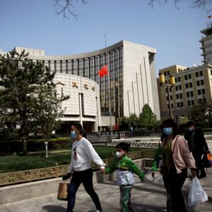 China central bank cuts rates on relending facility but benchmark cut chances seen low