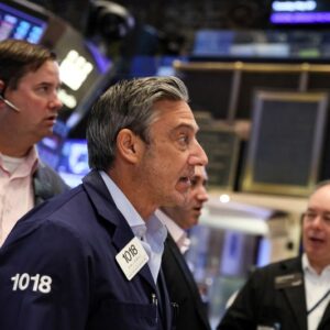 Wall Street rallies on jobs data, debt default averted